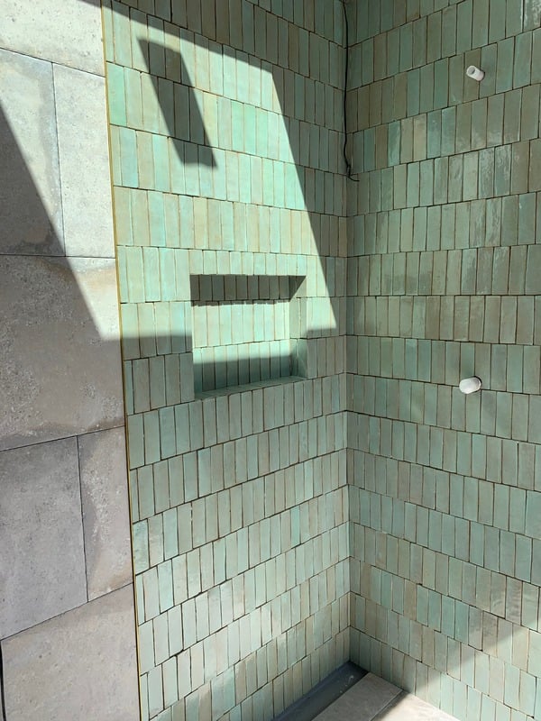 Freshly laid tiled wall with even grout lines on a Northern Beaches job